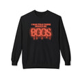 A black crewneck sweatshirt featuring a red and orange graphic on the chest that reads 'I WAS TOLD THERE WOULD BE BOOS' in dripping, glowing lettering, displayed against a plain white background.